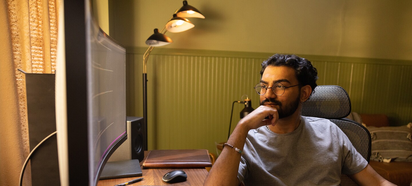 A man looking at a computer.