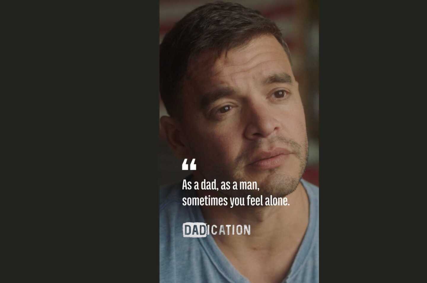 Father looking to the right with text that reads "as a dad, as a man, sometimes you feel alone."