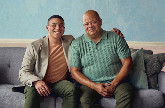Adopted teenage son and father smile at the camera